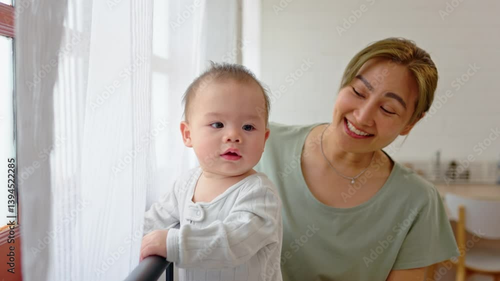 Asian single mother lovingly cares for and raises her baby boy at home. Asian single mother lovingly cares for and raises her baby boy at home.