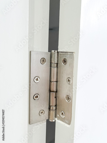 Doorknobs and door hinges are installed on the doors of the house for safety 