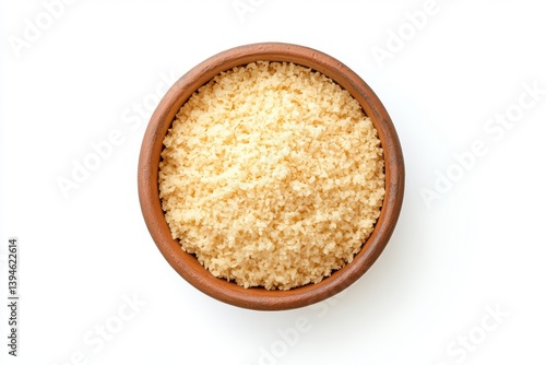 A top view of bulgur wheat in a brown bowl isolated on white background