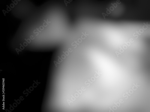 Black background with grey shadows, light shines from a cool angle above.