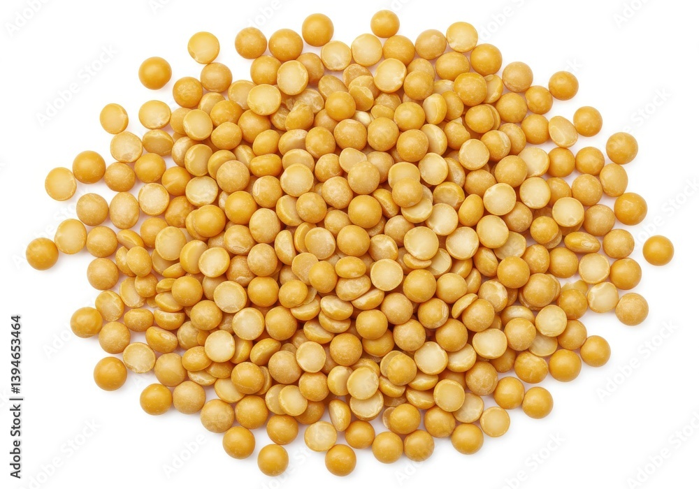 A large pile of dry yellow split peas scattered on a plain white surface in a studio setting view A large pile of dry yellow split peas scattered on a plain white surface in a studio setting view