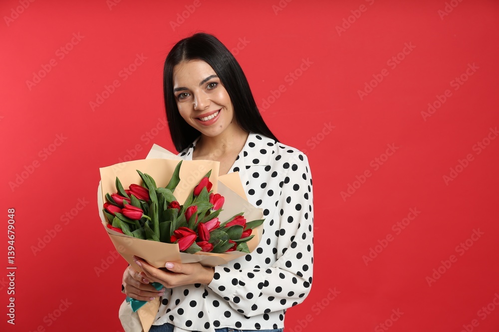 Happy woman with tulip flowers bouquet on red background, space for text. 8th of March celebration Happy woman with tulip flowers bouquet on red background, space for text. 8th of March celebration