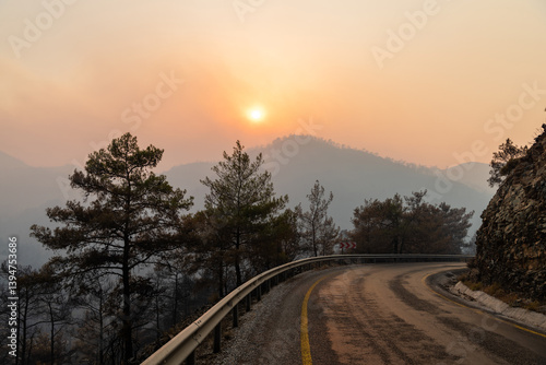 Photos Sun shining through a cloud of smoke on Icmeler-Hisaronu road, following forest