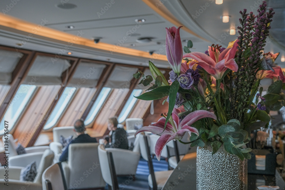 Cozy living room atmosphere inside cafe café coffee shop bar lounge bistro onboard luxury cruiseship cruise ship liner in contemporary Art Deco interior design