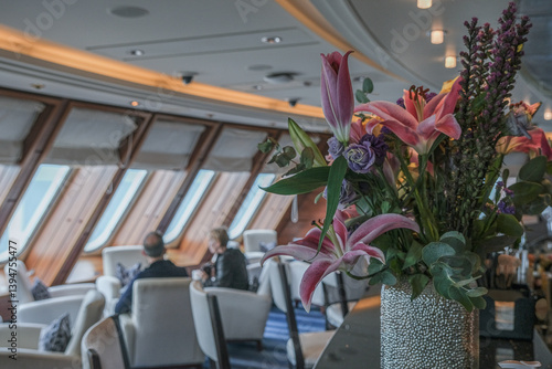 Cozy living room atmosphere inside cafe café coffee shop bar lounge bistro onboard luxury cruiseship cruise ship liner in contemporary Art Deco interior design
