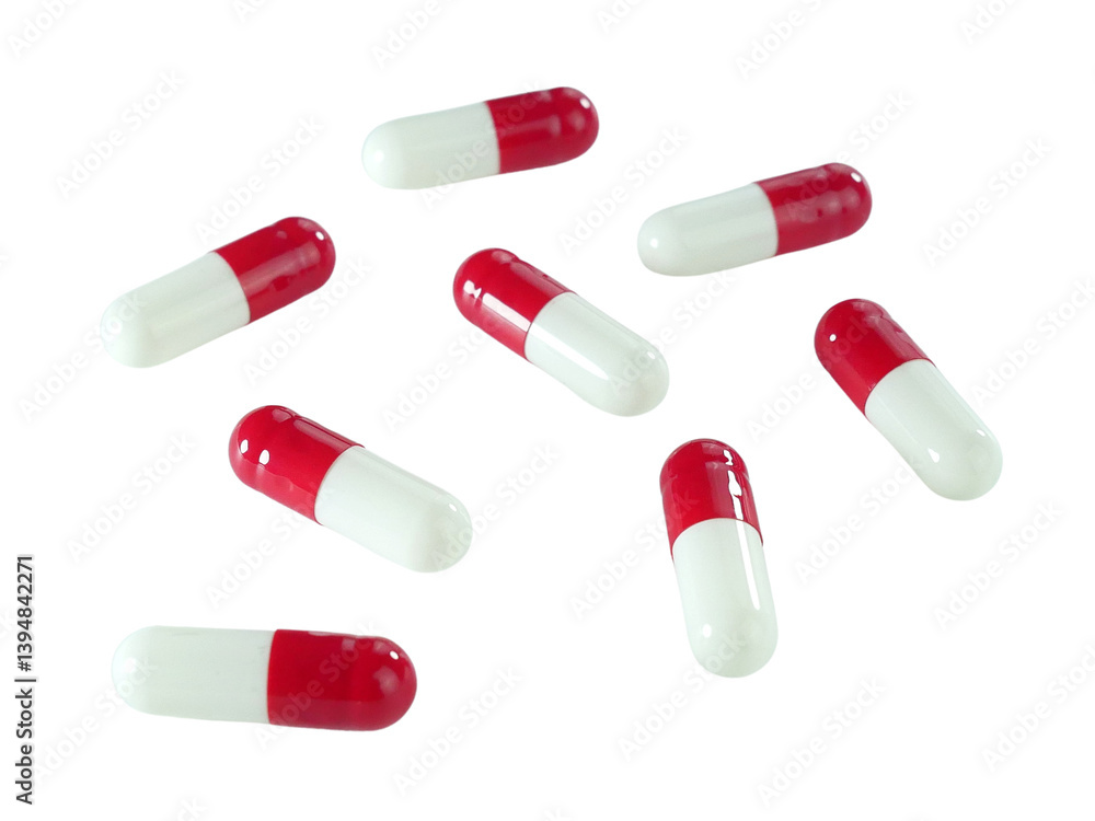 Bulk red and white capsule pills isolated on white background. Bulk red and white capsule pills isolated on white background.