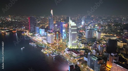 Wallpaper Mural Aerial view of Ho Chi Minh City skyline and skyscrapers on Saigon river, center of heart business at downtown. Night view. Financial and business concepts Torontodigital.ca