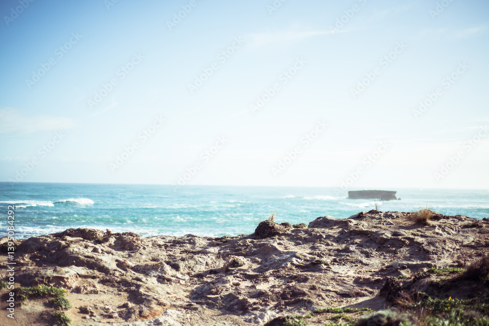 Looking out over rocky coastline to green ocean Looking out over rocky coastline to green ocean