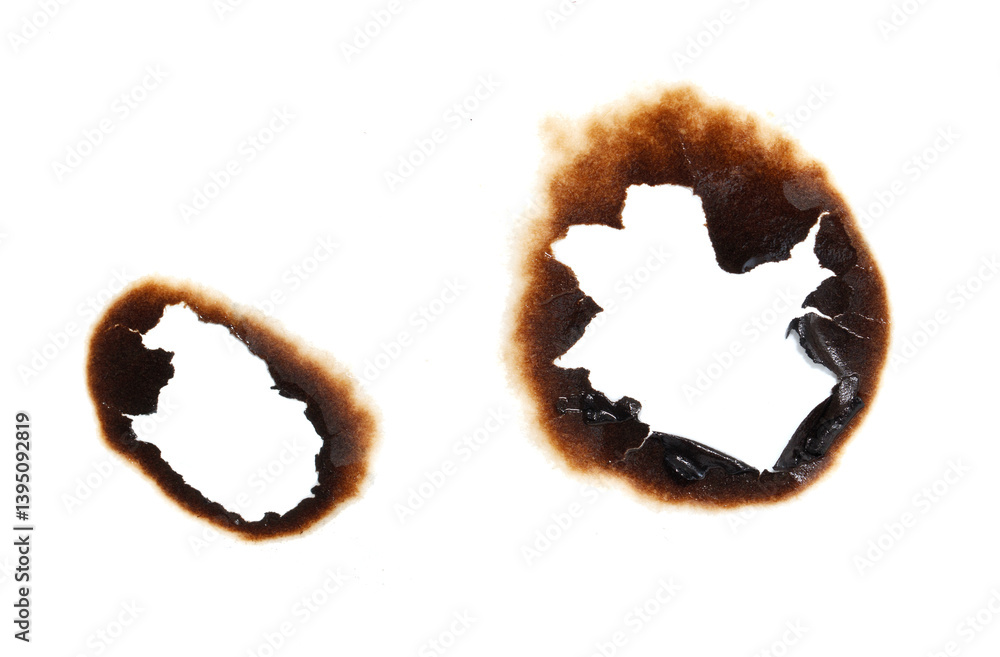 Two burned out holes in a piece of paper Two burned out holes in a piece of paper
