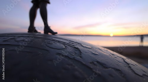 woman walking on the beach at sunset