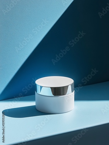Obraz na płótnie Minimalist Skincare Product Jar on Light Blue Surface with Shadow w salonie