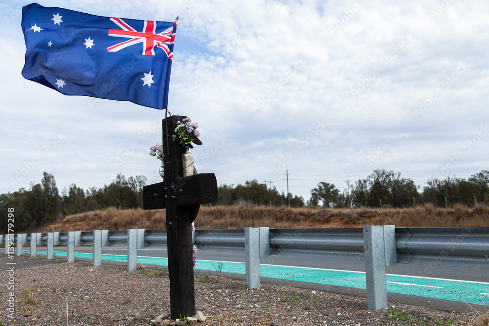 Roadside memorial cross with Australian flag Roadside memorial cross with Australian flag