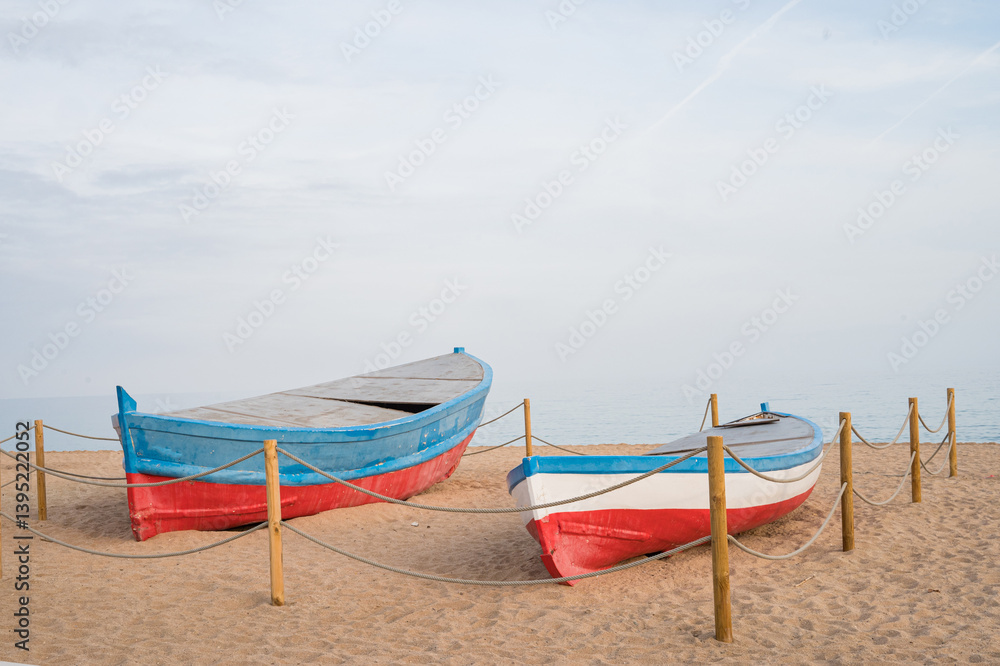 Rustic wooden boats on sandy beach against tranquil seascape Rustic wooden boats on sandy beach against tranquil seascape