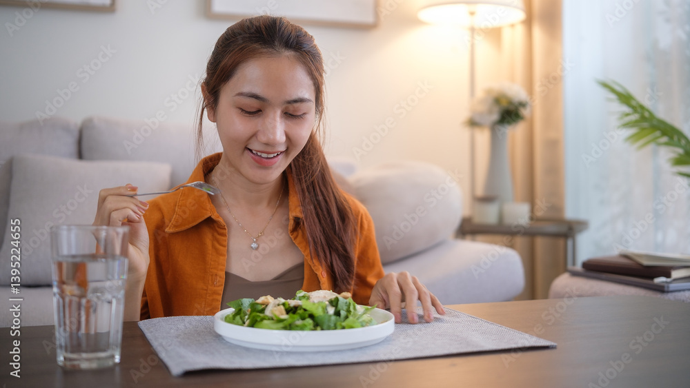 Woman in casual outfit enjoying a nutritious meal in a comfortable living room setting. Woman in casual outfit enjoying a nutritious meal in a comfortable living room setting.