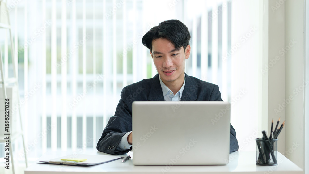 Confident businessman working from a bright and minimal office space, symbolizing innovation, leadership, and corporate success. Confident businessman working from a bright and minimal office space, symbolizing innovation, leadership, and corporate success.