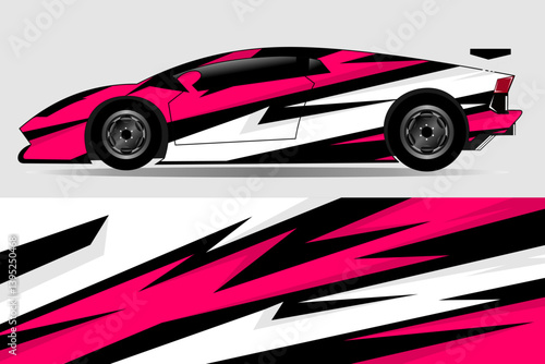Sleek sports car with striking pink and black geometric design parked against a minimalist backdrop