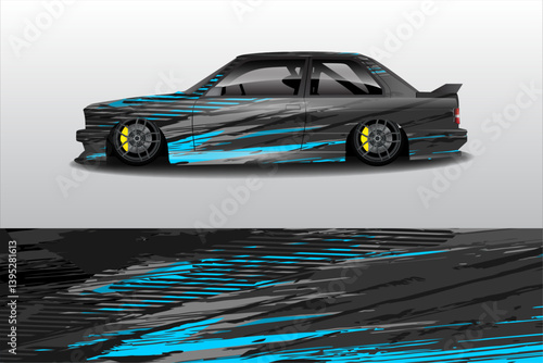 Sleek modified car with vibrant blue and black design, showcased in a minimalistic setting