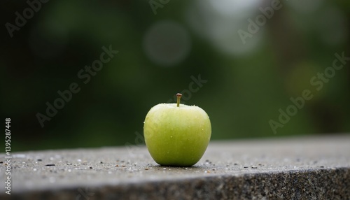 Green apple on a wooden table