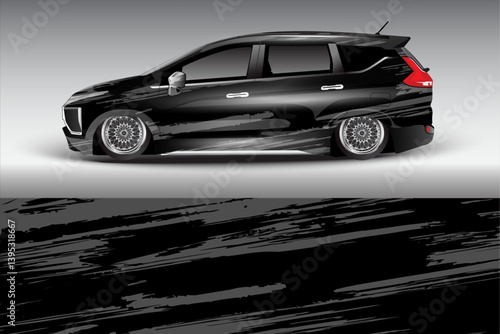 Sleek black modified car with custom wheels parked against a gradient gray background, showcasing automotive design