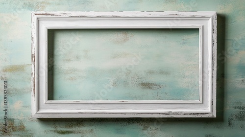 Obraz na płótnie A distressed white wooden frame, large and rectangular, placed on a faded green wall, radiating a vintage cottage aesthetic. w salonie