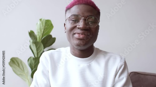 Emotional online chat conversation of a young African American blogger. Funny discussion, active hand gestures.