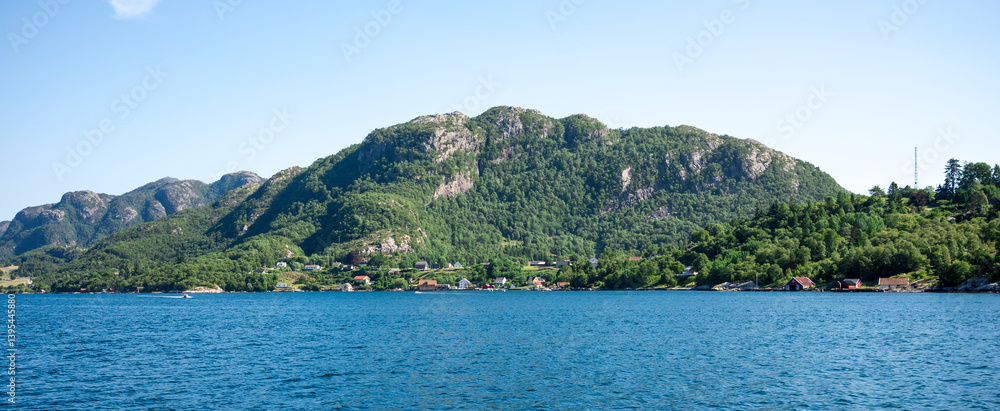 Scenic View on Green Mountains and Fjord Shoreline with Cottages From a Cruise Boat, Stavanger, Norway, June 2018