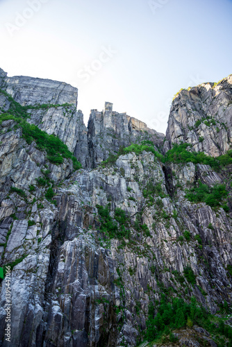 Obraz na płótnie Amazing View to Steep Rocky Cliffs And Preikestolen From a Cruise Boat in Fjord, Stavanger, Norway, June 2018 w salonie