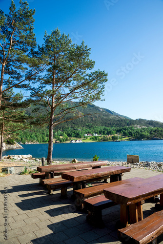 Obraz na płótnie Picnic Area With Natural Wood Tables and Benches And Scenic Mountain View in Lysefjord Fjord, Stavanger, Norway, June 2018 w salonie