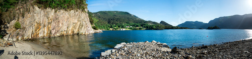Obraz na płótnie Scenic View of a Beautiful Calm Lysefjord Fjord Surrounded by Mountains from a Small Beach, Stavanger, Norway, June 2018 w salonie