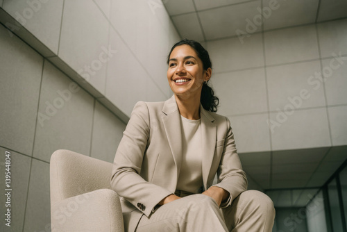 Radiant Professional Woman in Minimalist Business Surroundings, Unconventional Business Advertising Portrait