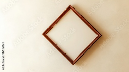 A thin mahogany frame in a diamond shape, tilted and mounted on a cream-colored wall, giving a unique twist to traditional design.