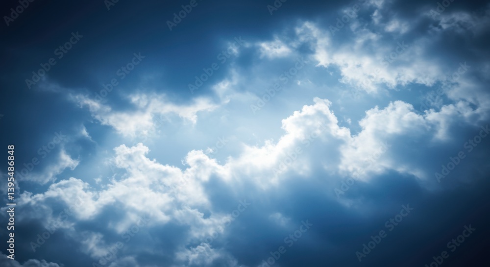 Fototapeta premium Dramatic clouds illuminated by sunlight, creating a moody atmosphere in the sky