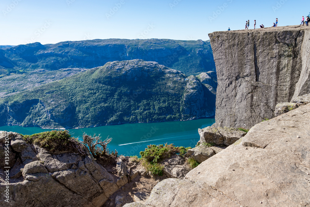 Tourists Exploring Pulpit Rock Cliff and Lyesfjord Fjord on a Clear Sunny Day, Stavanger, Norway, July 2018