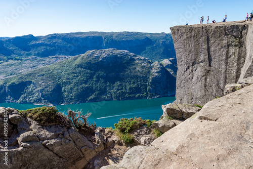 Obraz na płótnie Tourists Exploring Pulpit Rock Cliff and Lyesfjord Fjord on a Clear Sunny Day, Stavanger, Norway, July 2018 w salonie