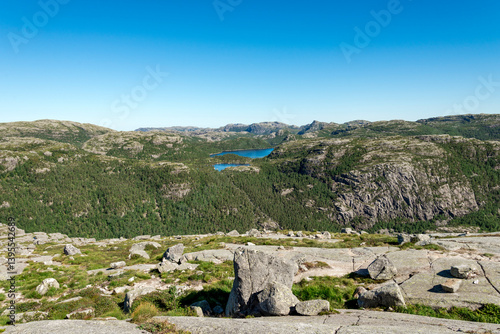 Obraz na płótnie Scenic Mountain Landscape with Rocky Terrain and Green Forests From Preikestolen Hiking Trail, Stavanger, Norway, July 2018 w salonie