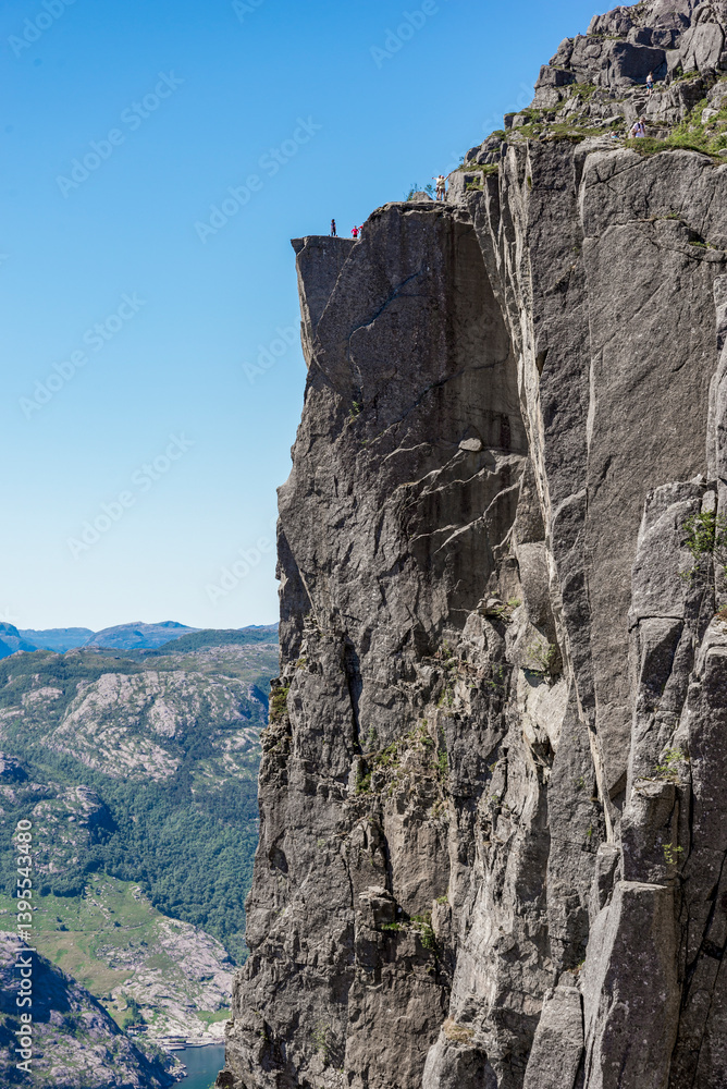 Majestic Cliffside View Under Sunny Skies with Distant Mountains and Scenic Landscape, Stavanger, Norway, July 2018