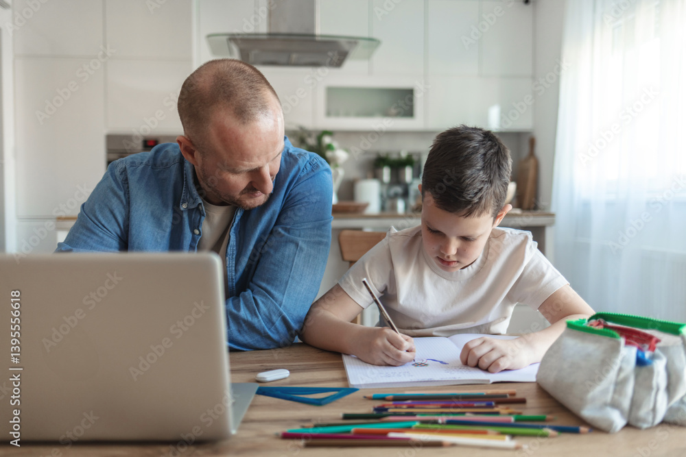 Father and son sitting side by side at home to work and study. Caucasian ethnicity father and son working and learning at home during the day. Father and son sitting side by side at home to work and study. Caucasian ethnicity father and son working and learning at home during the day.