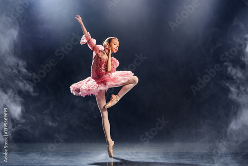 little ballerina gracefully performs a ballet pose, demonstrating elegance and skill in a classic pink tutu on pointe shoes.