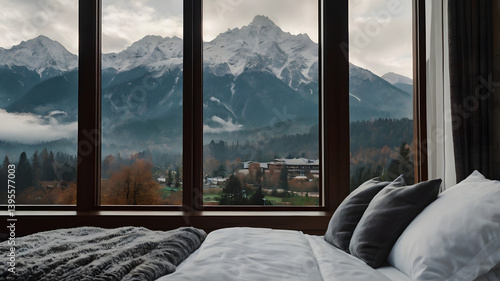 Obraz na płótnie Wide closeup photograph of view from a luxury cozy hotel bedroom window, cozy couch with pillows and coffee cup on a tray, misty mountain range landscape outside in a cold day morning w salonie