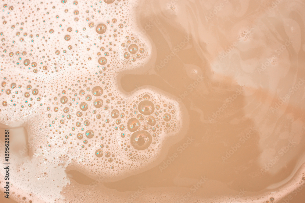 Fototapeta premium White soap foam on beige background, abstract backdrop for product placement