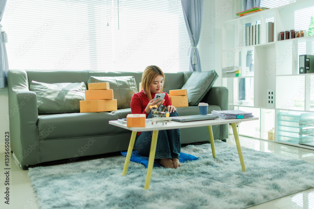 A young woman is starting her SME business, checking information and preparing packages to be shipped to customers. A young woman is starting her SME business, checking information and preparing packages to be shipped to customers.