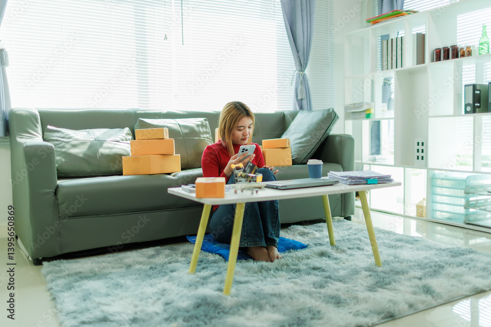 A young woman is starting her SME business, checking information and preparing packages to be shipped to customers. A young woman is starting her SME business, checking information and preparing packages to be shipped to customers.