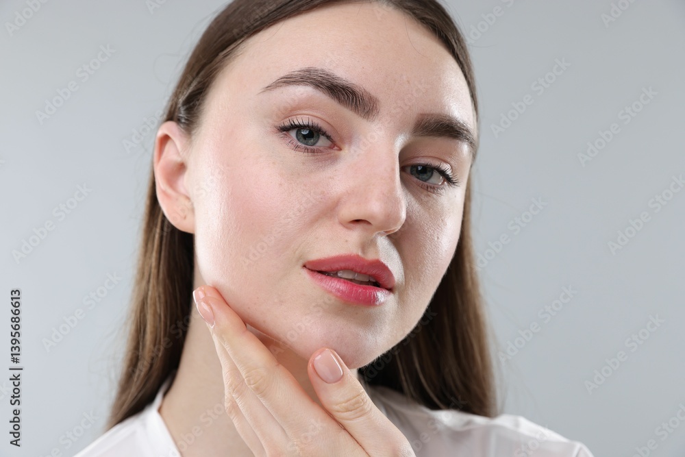 Woman with healthy skin on grey background, closeup Woman with healthy skin on grey background, closeup