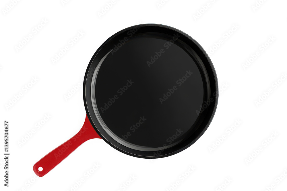 Top view of a skillet with a red handle against a dark setting Top view of a skillet with a red handle against a dark setting