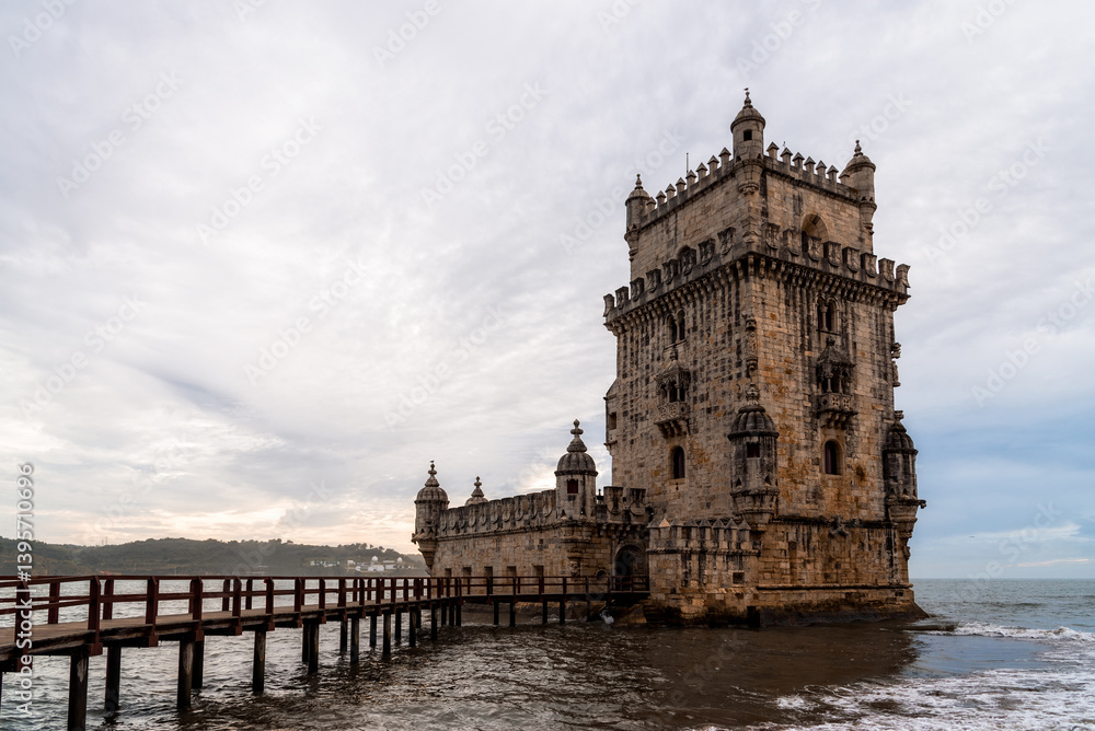 Fototapeta premium Belem Tower stands majestically on the Tagus River, a historic symbol of Lisbon maritime past.
