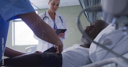 Consulting patient in hospital bed, doctor using animation with digital network