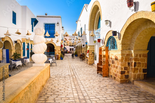 A street with shops in the Medina of Yasmine Hammamet, Tunisia.	