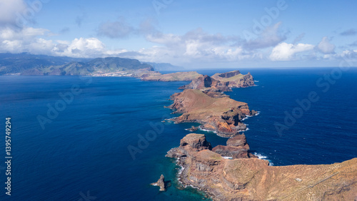Stunning coastal landscape captures the rugged beauty of cliffs and the deep blue ocean under a bright sky