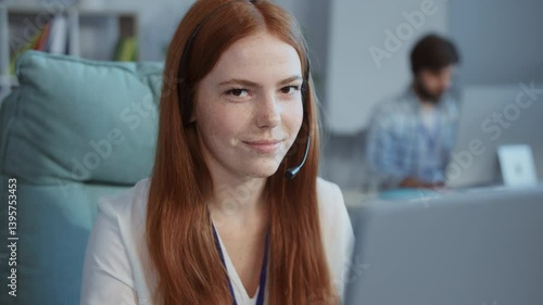 Wallpaper Mural A cheerful woman with red hair works at her laptop in a bright, inviting space Torontodigital.ca