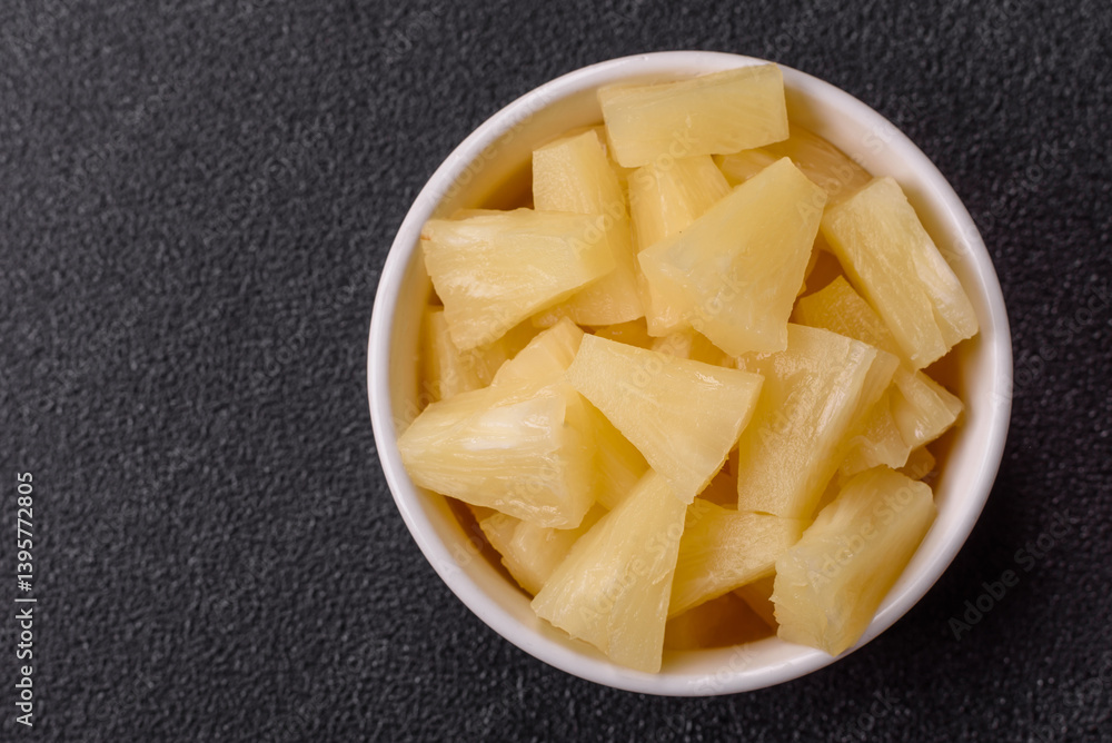 Tropical sweet tinned pineapple fruit sliced into slices Tropical sweet tinned pineapple fruit sliced into slices